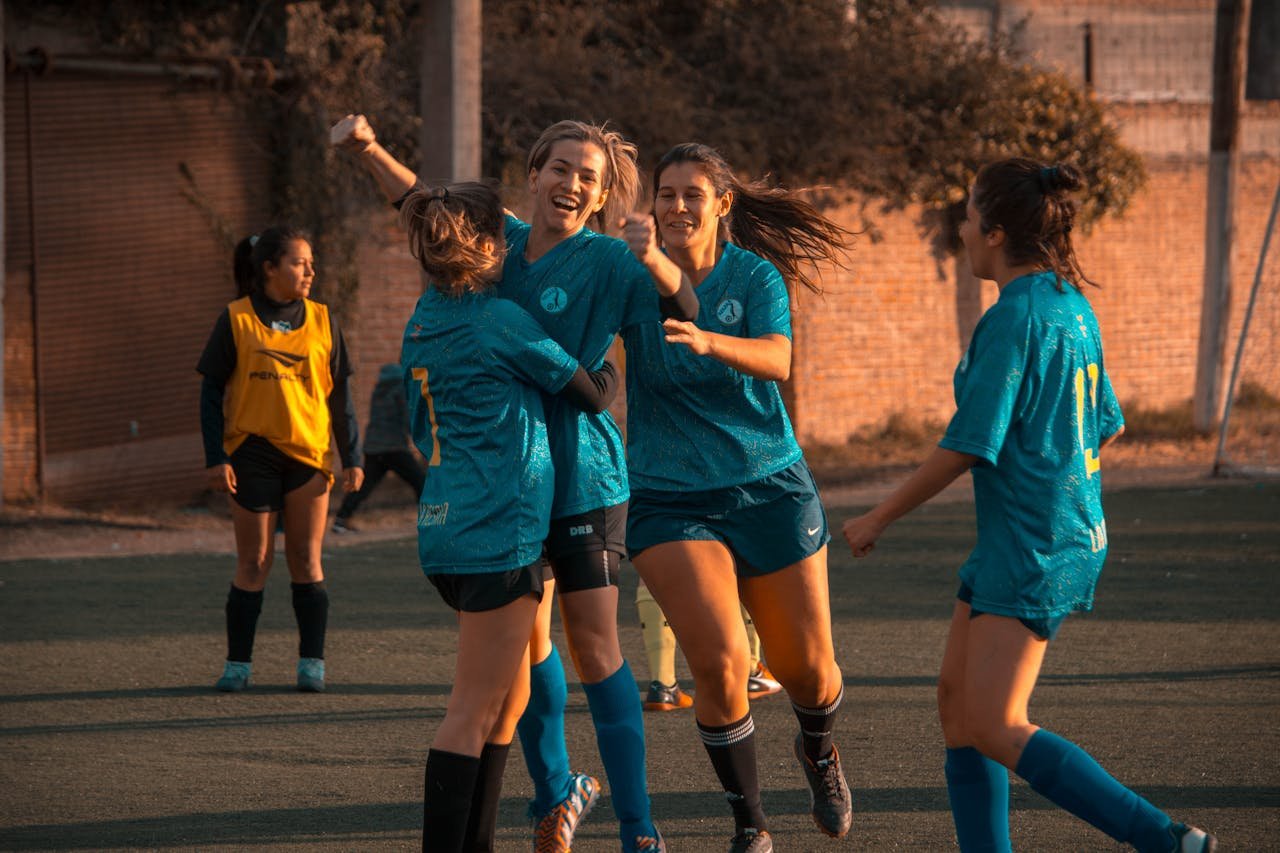 services-09 Women's soccer team celebrates a win during a game in Córdoba, Argentina.