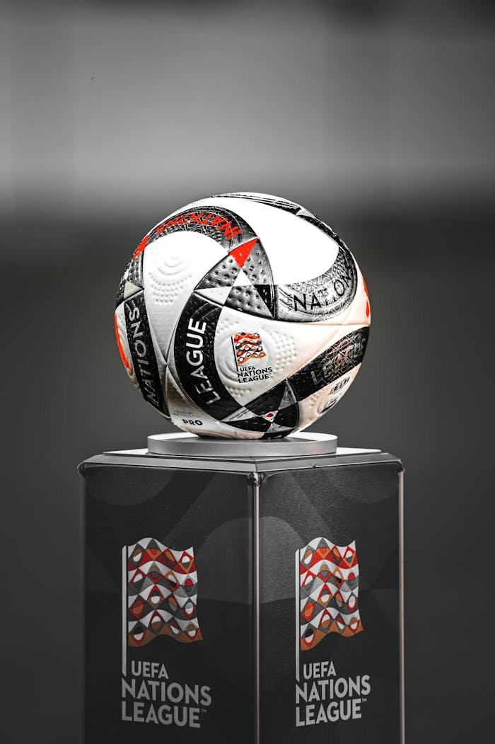 services-05 Close-up of the UEFA Nations League match ball on a podium, showcasing design details.